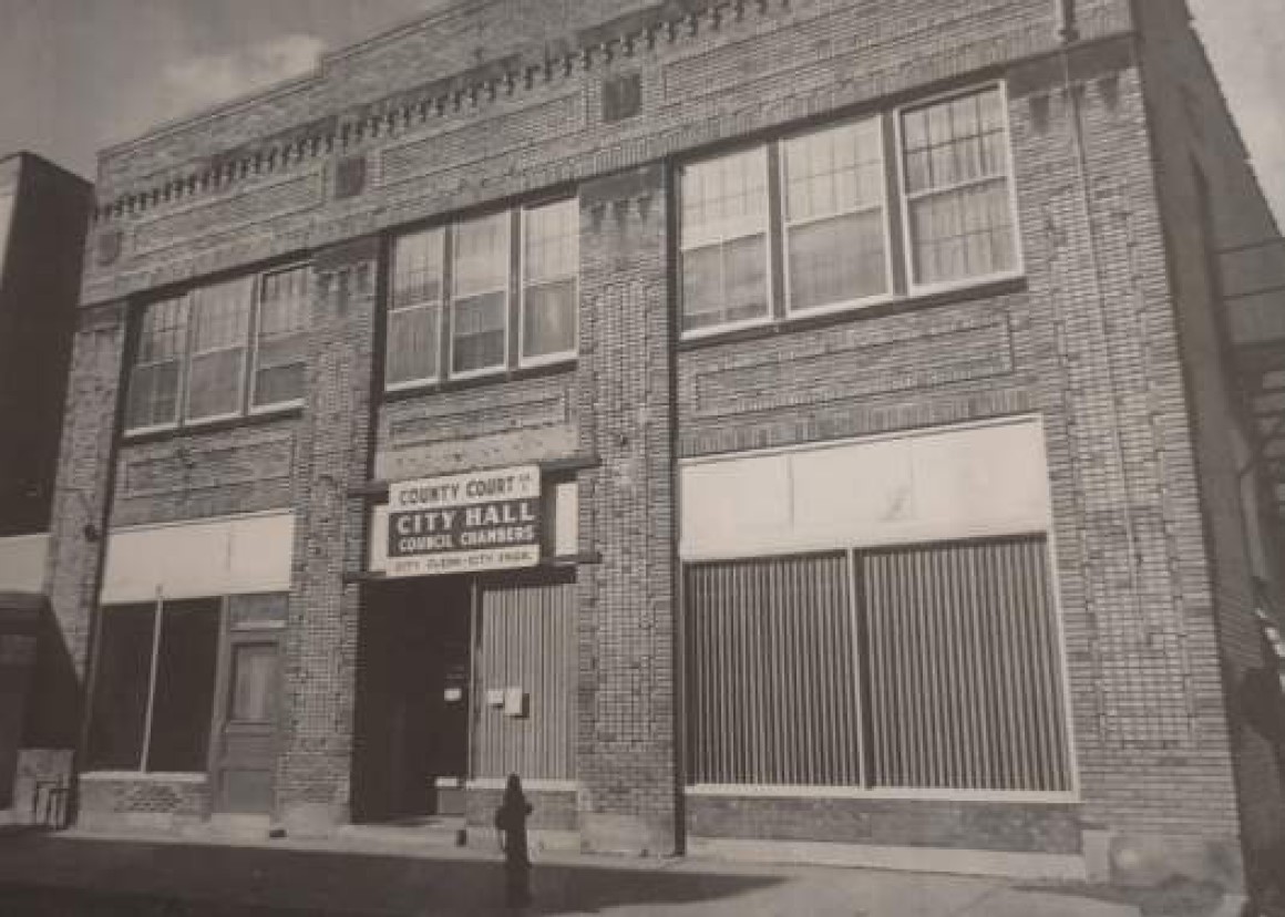 Historic photograph of 100 Sibley with County Court and City Hall signage