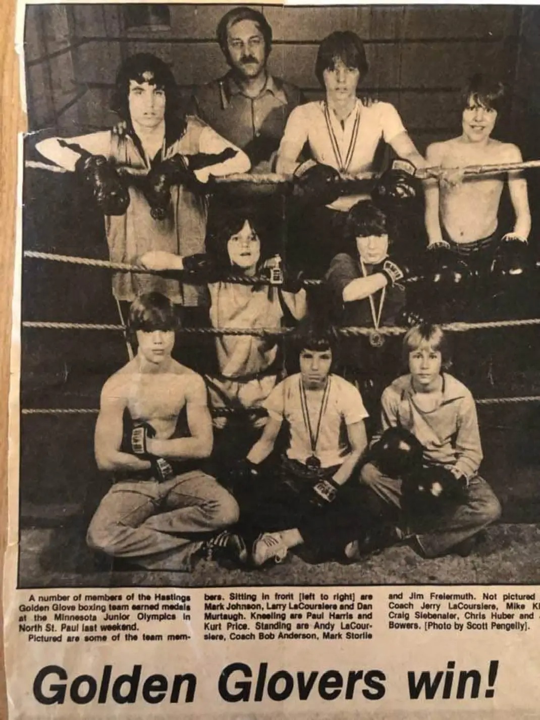 Newspaper photograph of Hastings Golden Glove boxing team members and coach in a boxing ring