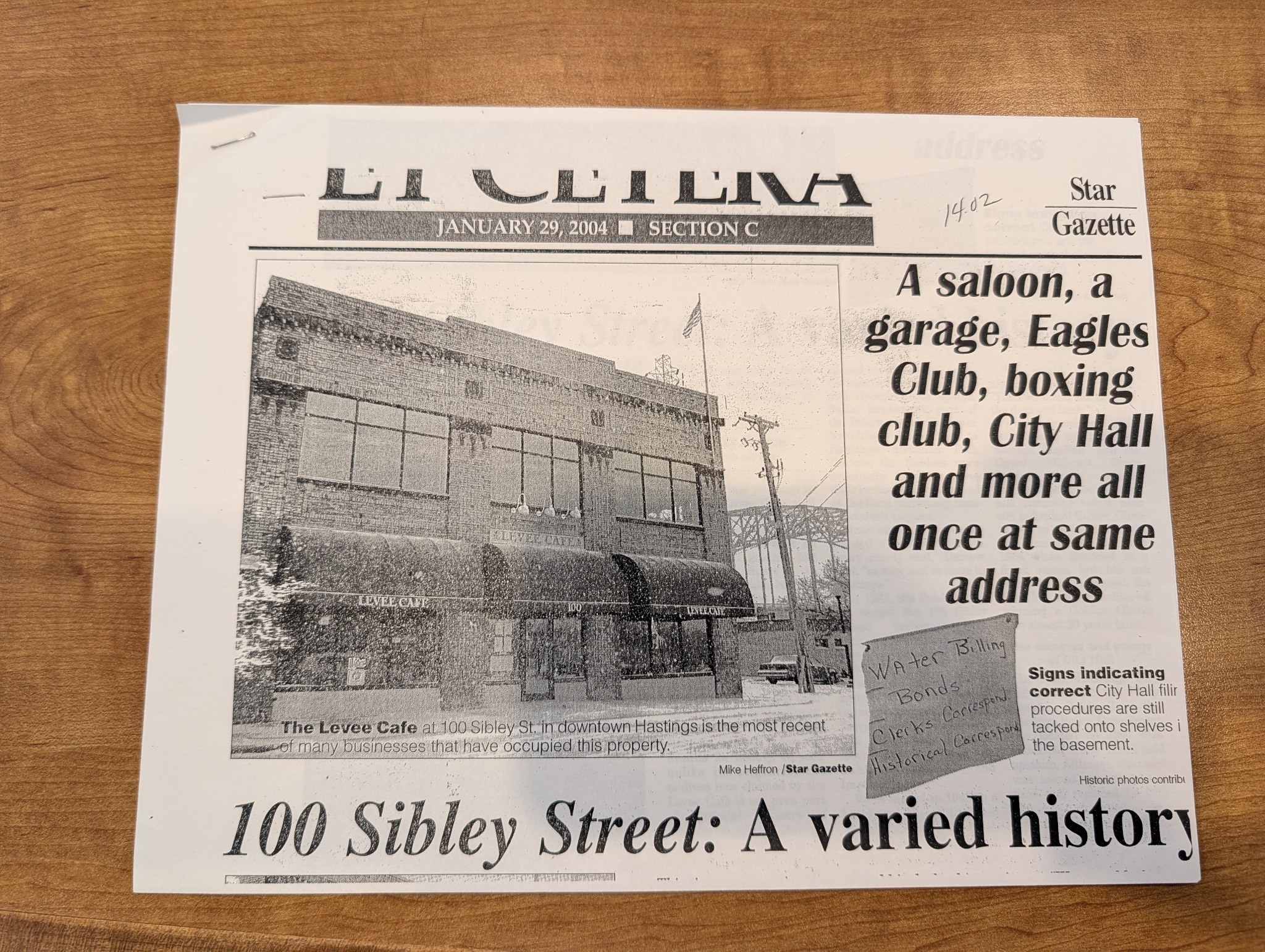 January 29, 2004 Star Gazette clipping showing the Levee Cafe facade and headline about the history of 100 Sibley